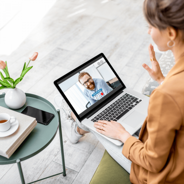 Recruiting Manager Job Opening at NuWest Woman talking to a man on a video call